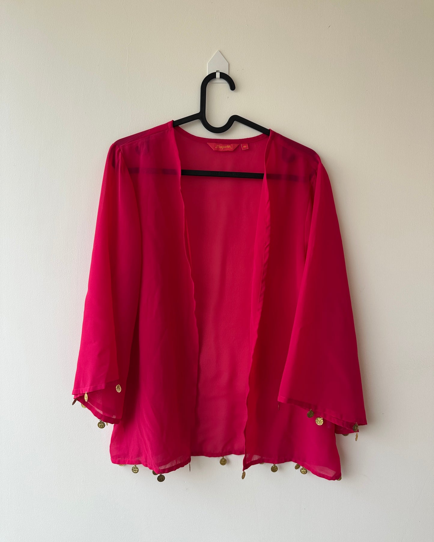 Pink oversized shrug with coin accessories