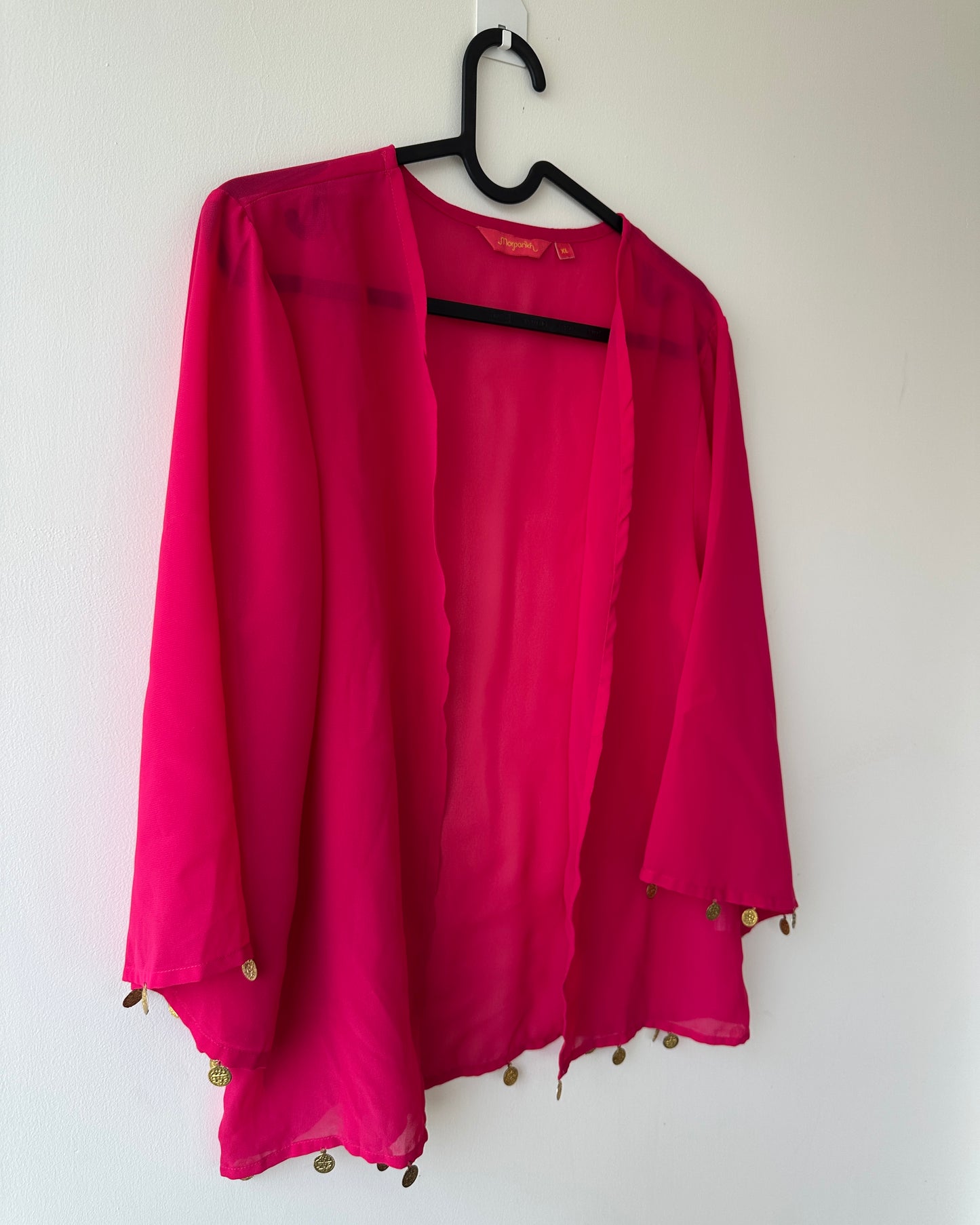 Pink oversized shrug with coin accessories