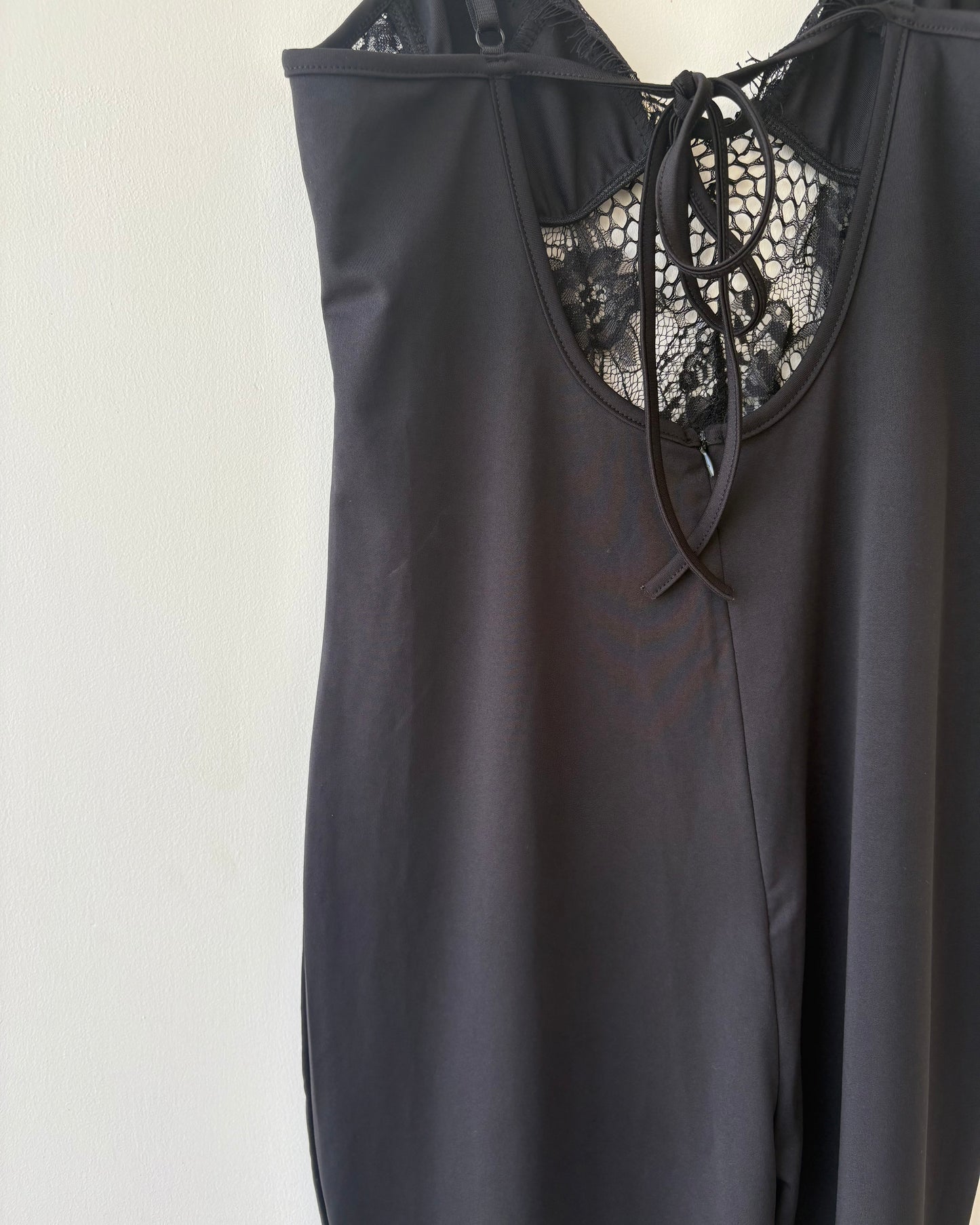 Black jumpsuit with lace bodice and back tie-up
