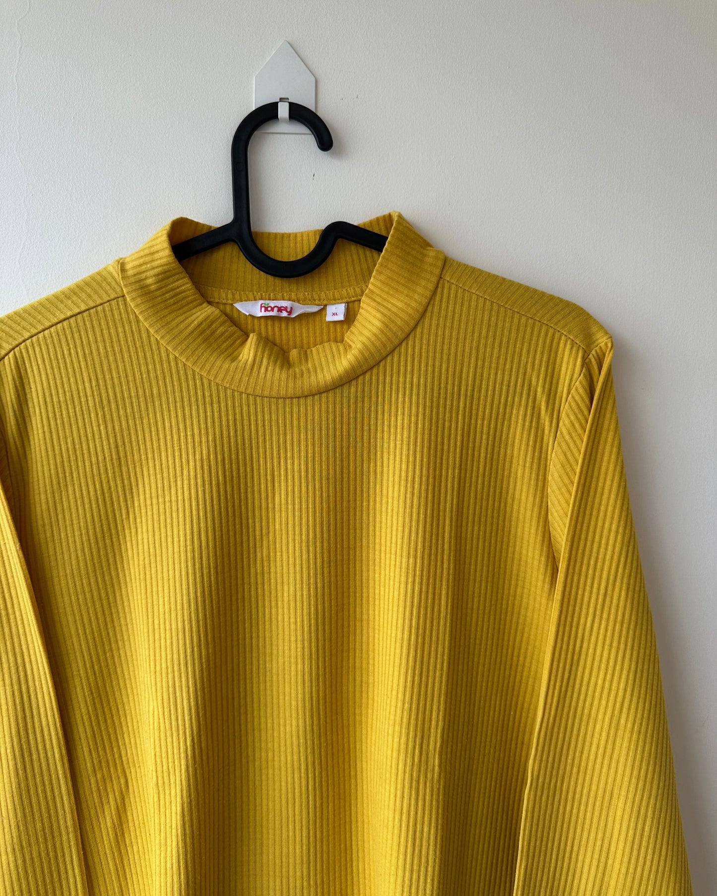 Yellow high neck top with long sleeves