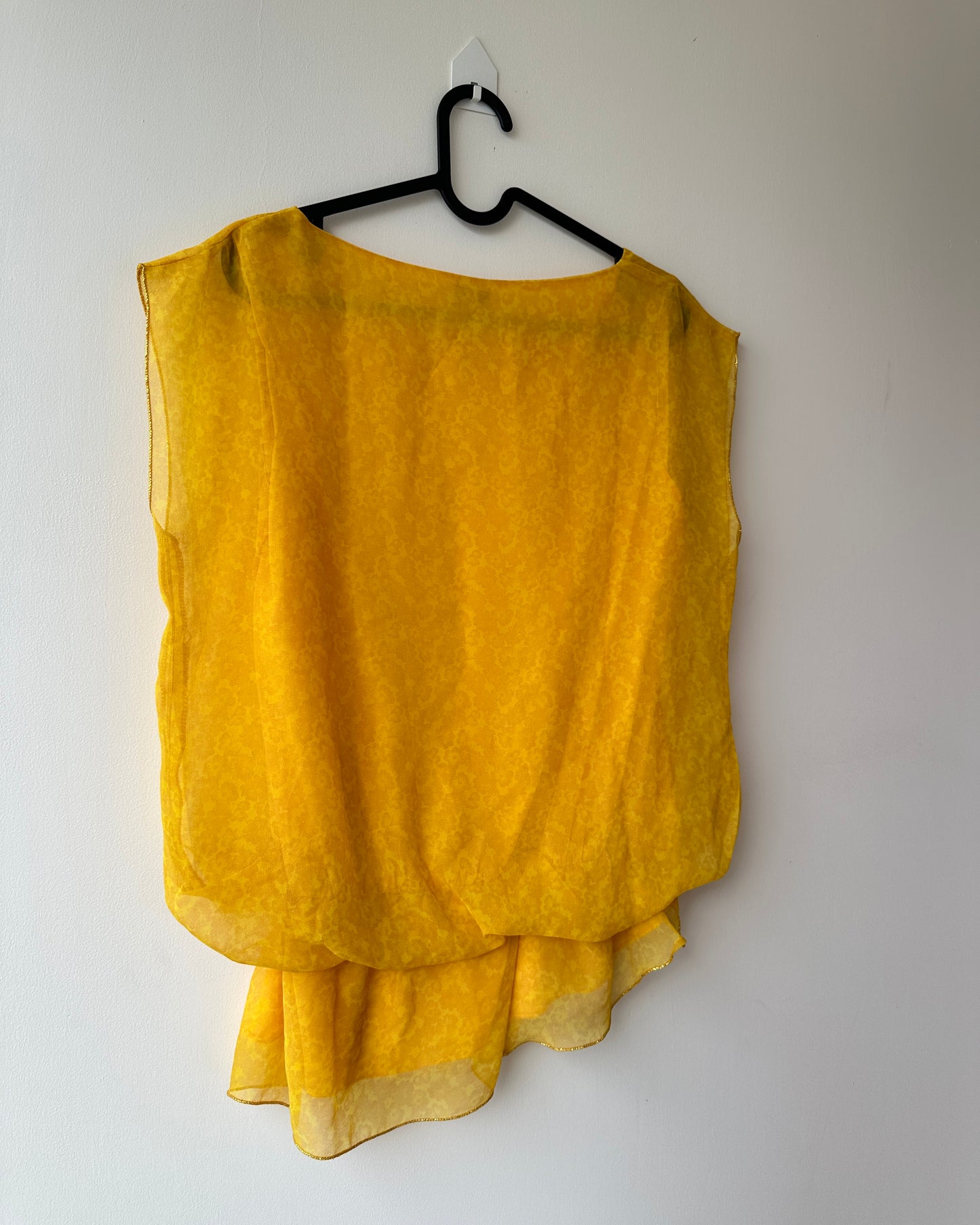 Yellow patterned blouse with asymmetrical hem