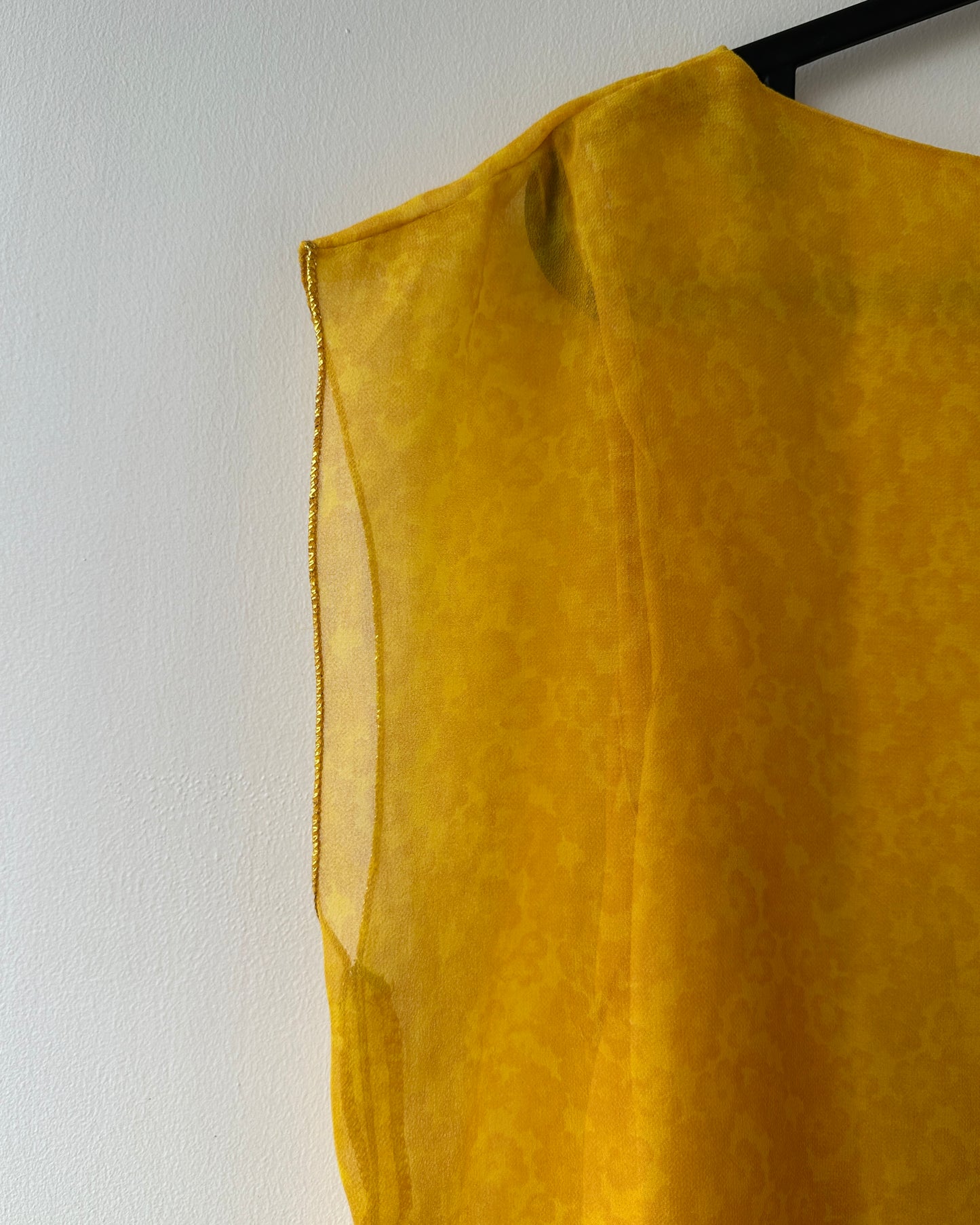 Yellow patterned blouse with asymmetrical hem