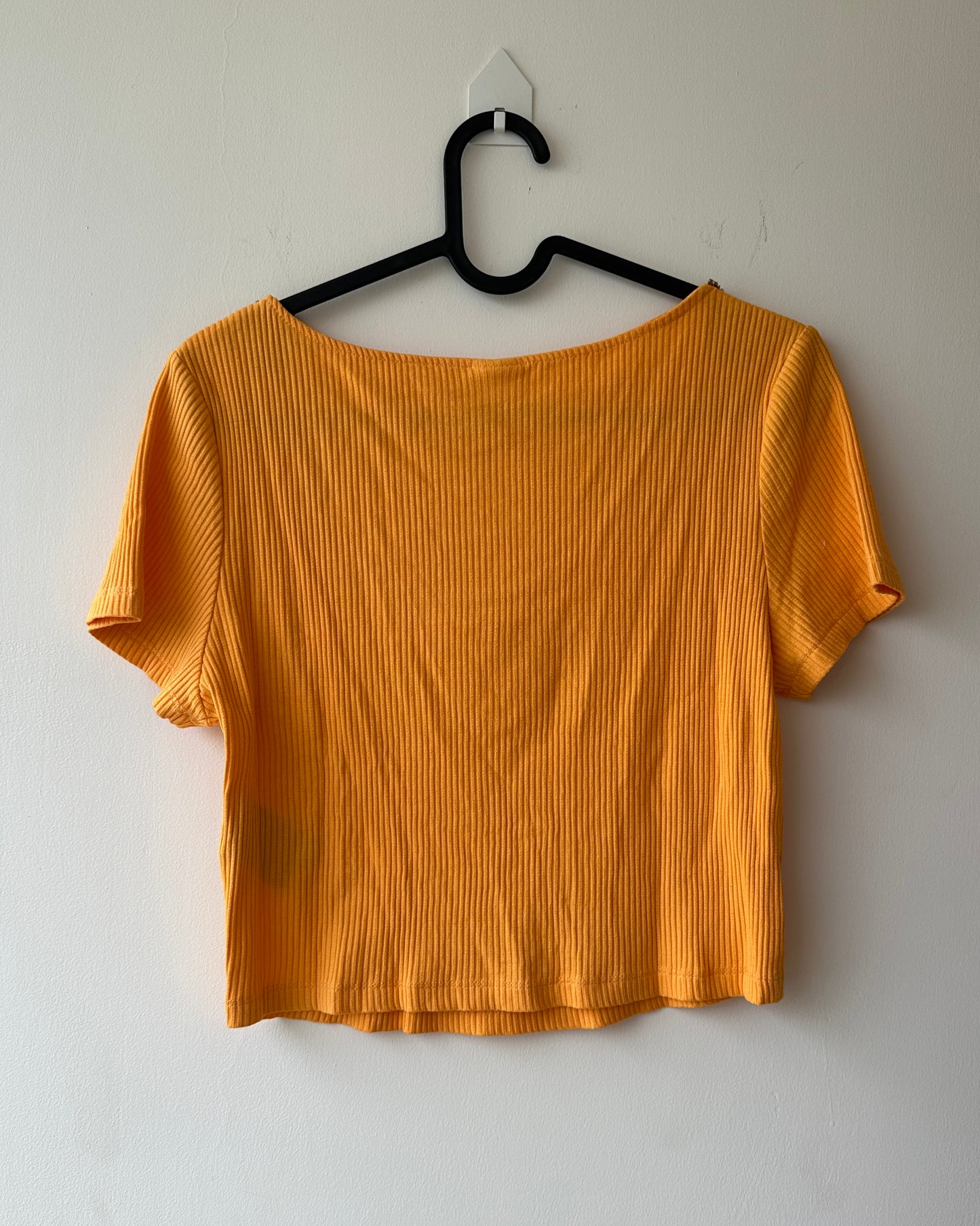 Orange knit crop top with embellishments