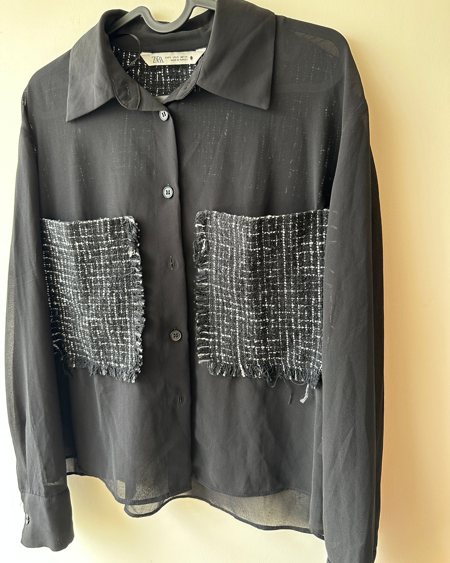 Black sheer top with patch pockets