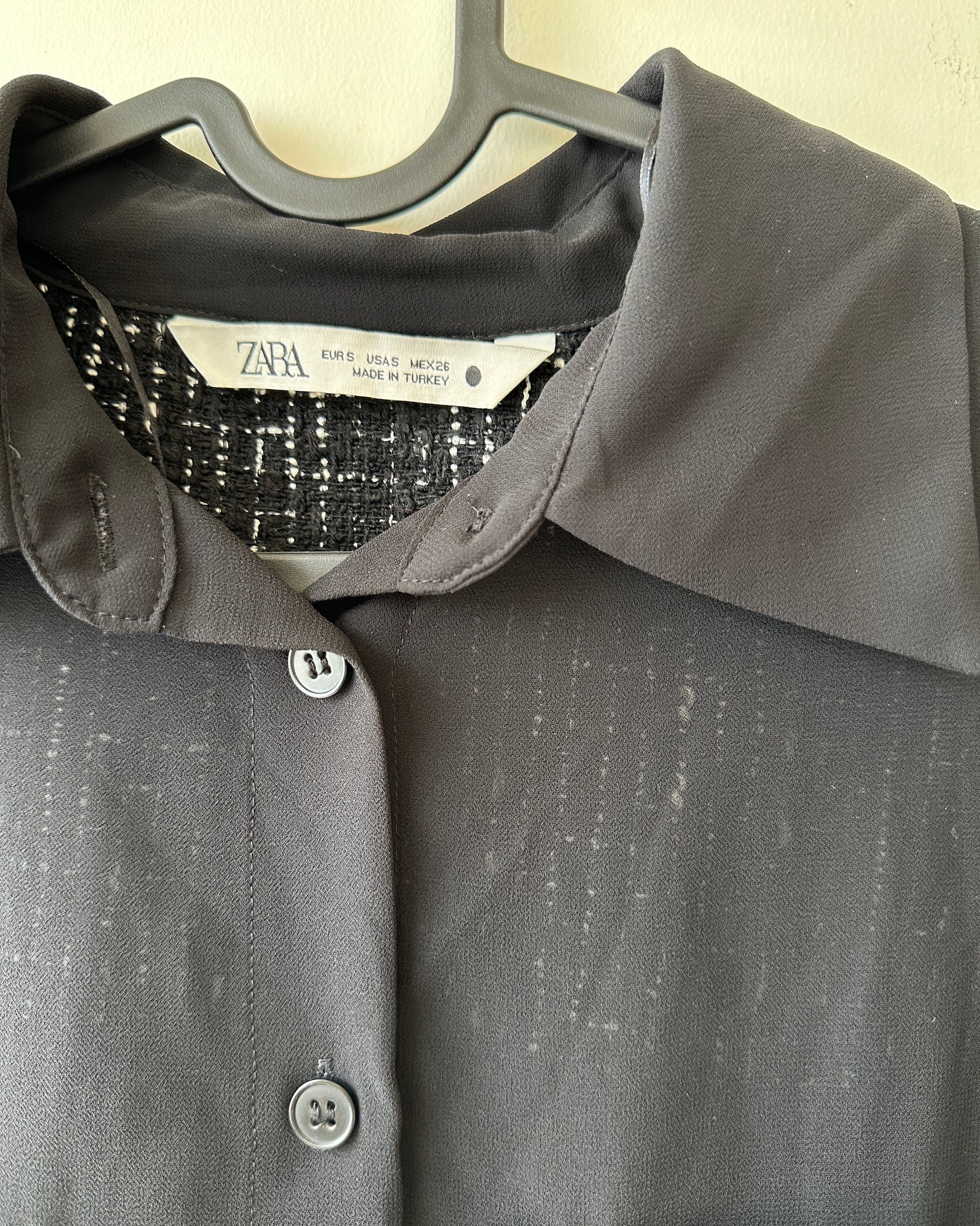 Black sheer top with patch pockets