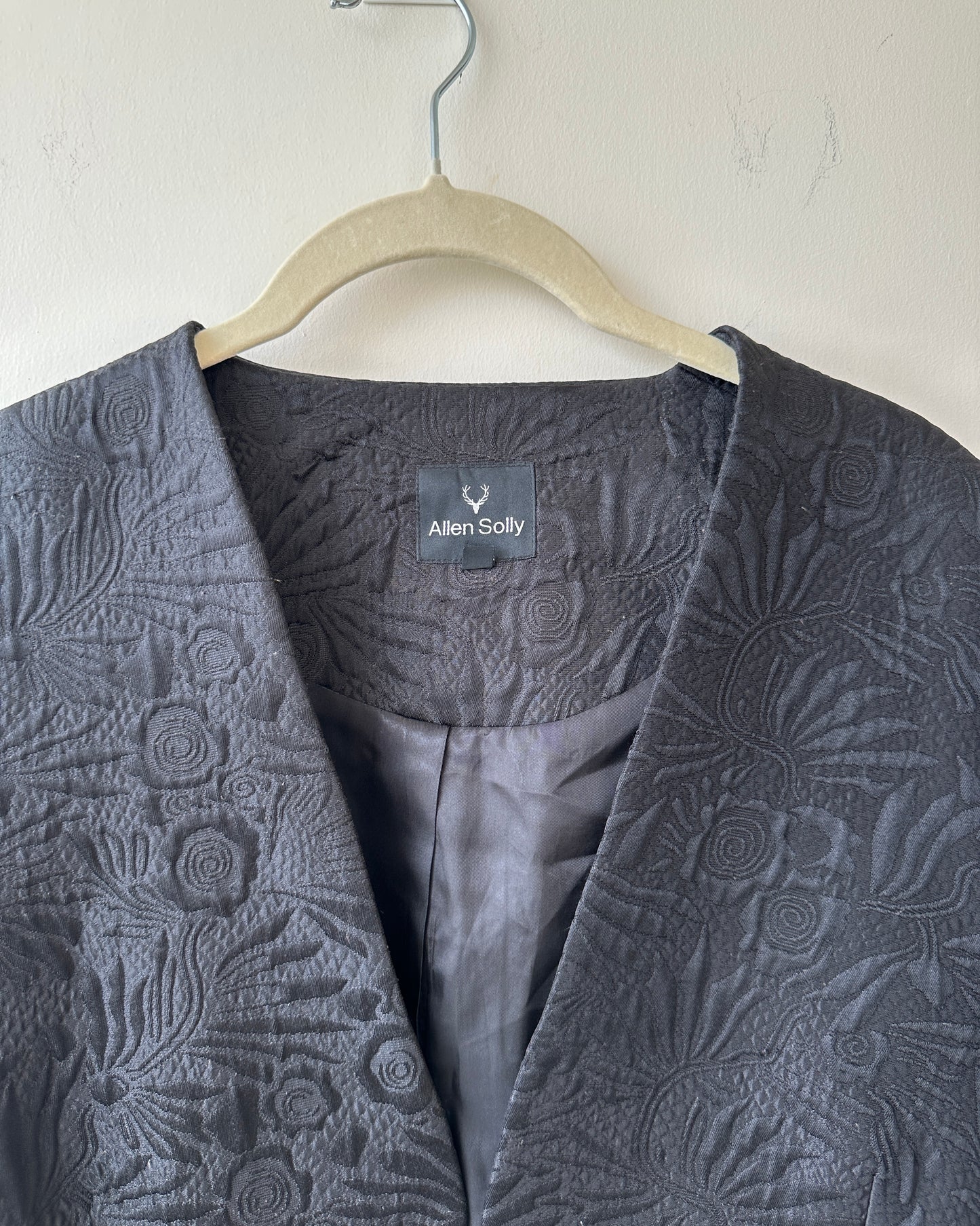 Black textured blazer with front pockets