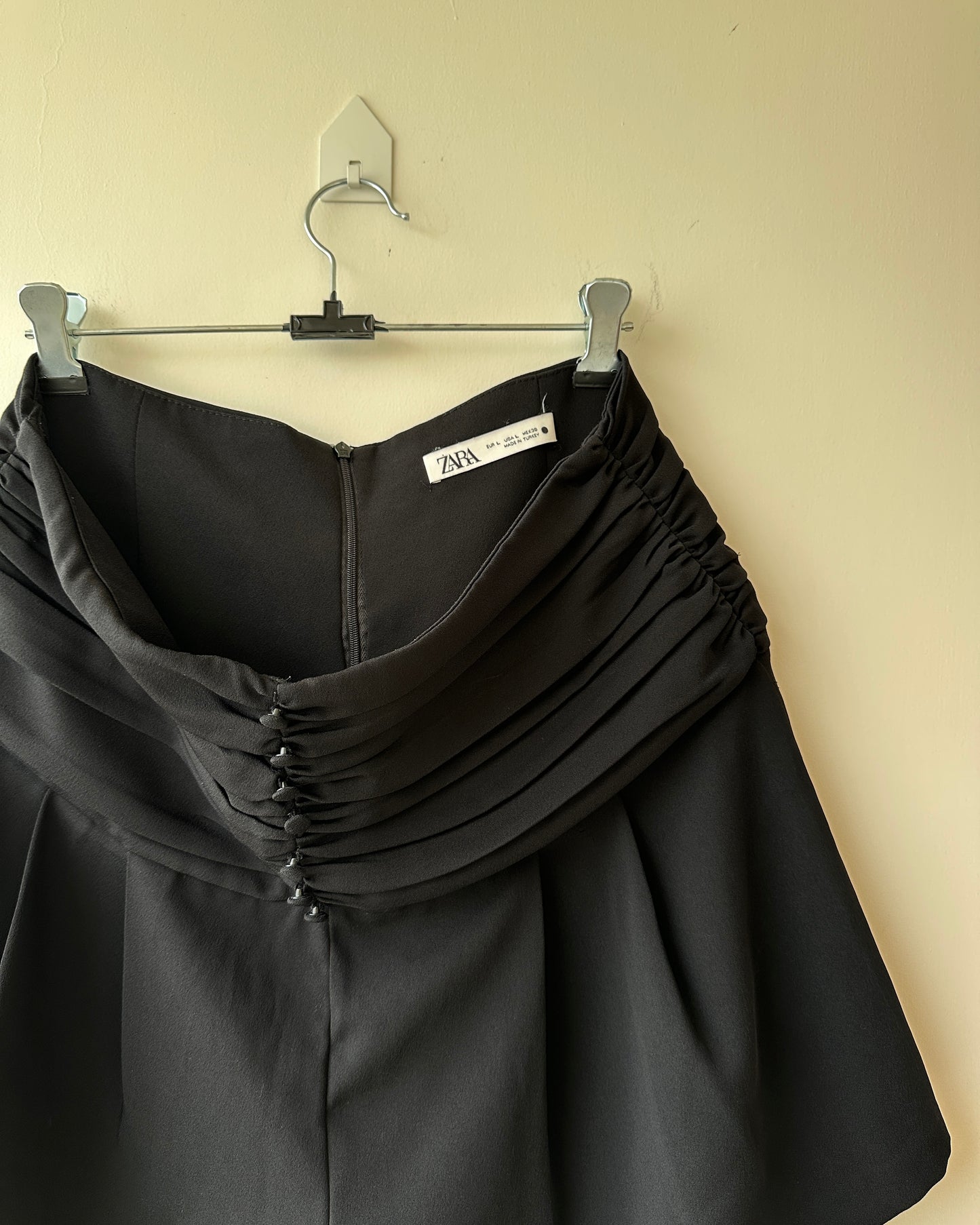 Black pleated high waist shorts with buttons