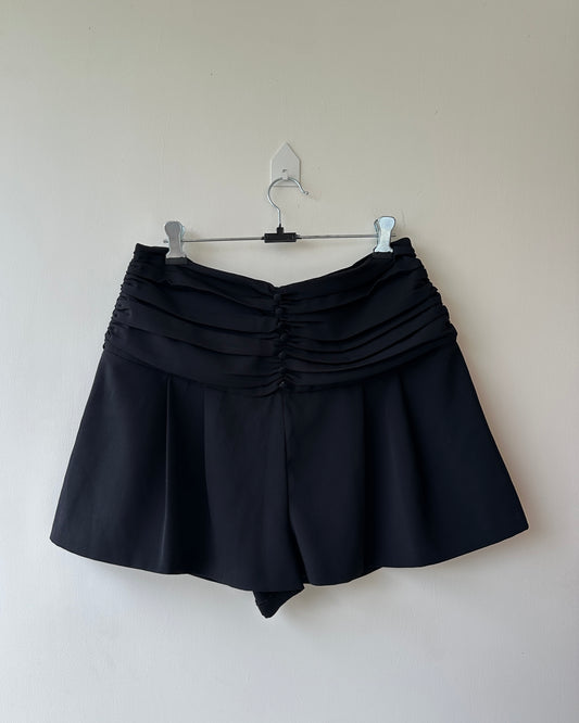 Black pleated high waist shorts with buttons