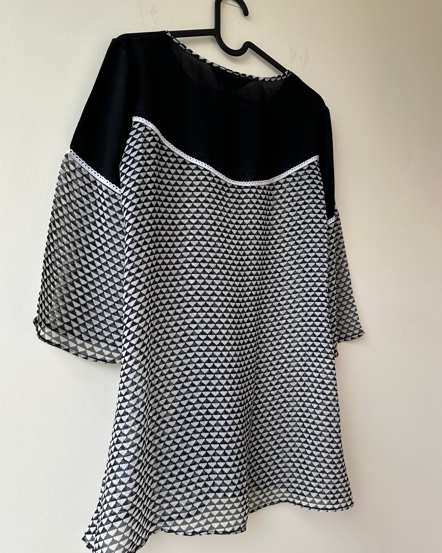 Black and white sheer top with bell sleeves