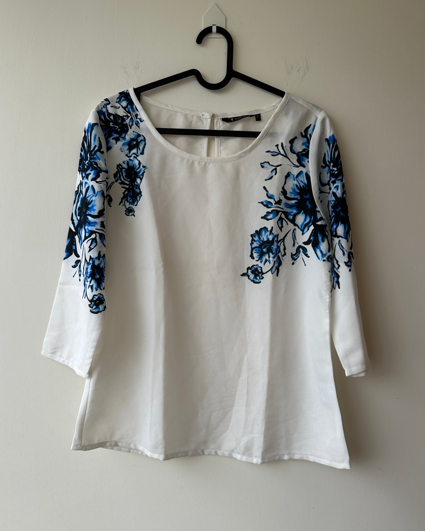White formal top with blue flowers
