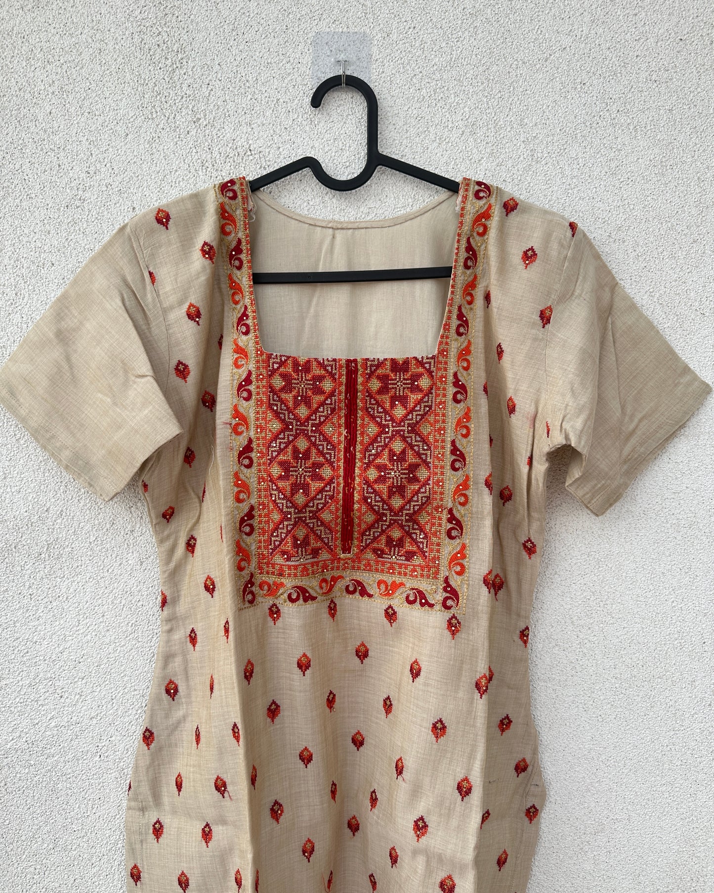 Beige kurta with red embroidery