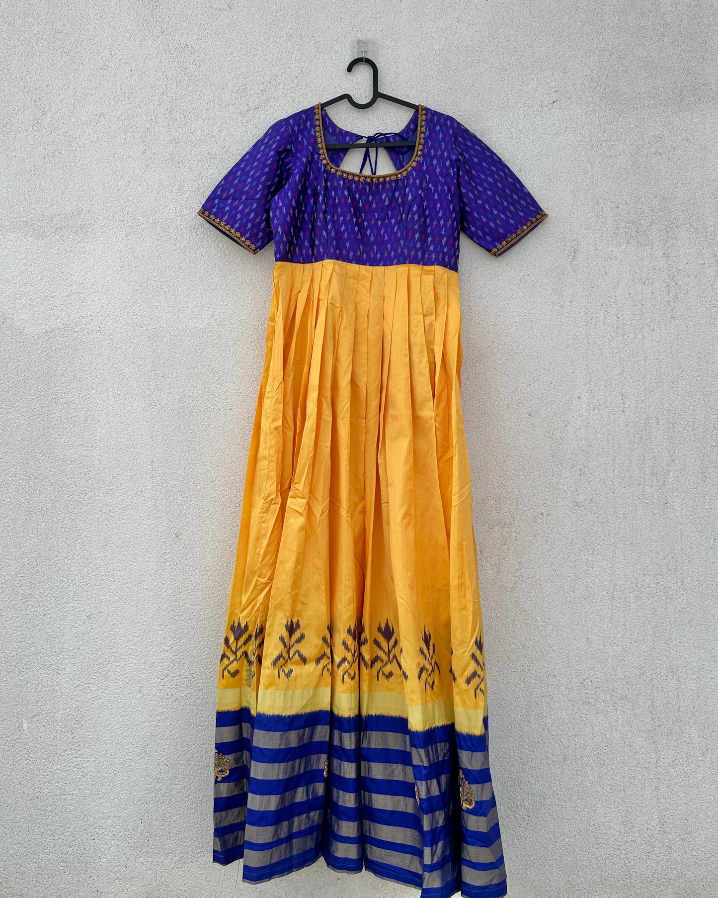 Blue and yellow pleated ikat silk gown with embroidery