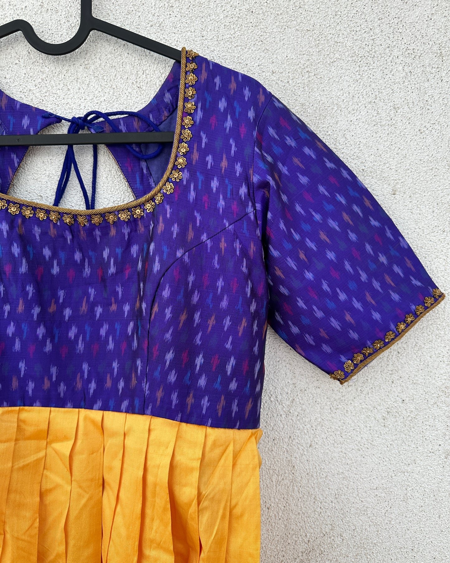 Blue and yellow pleated ikat silk gown with embroidery
