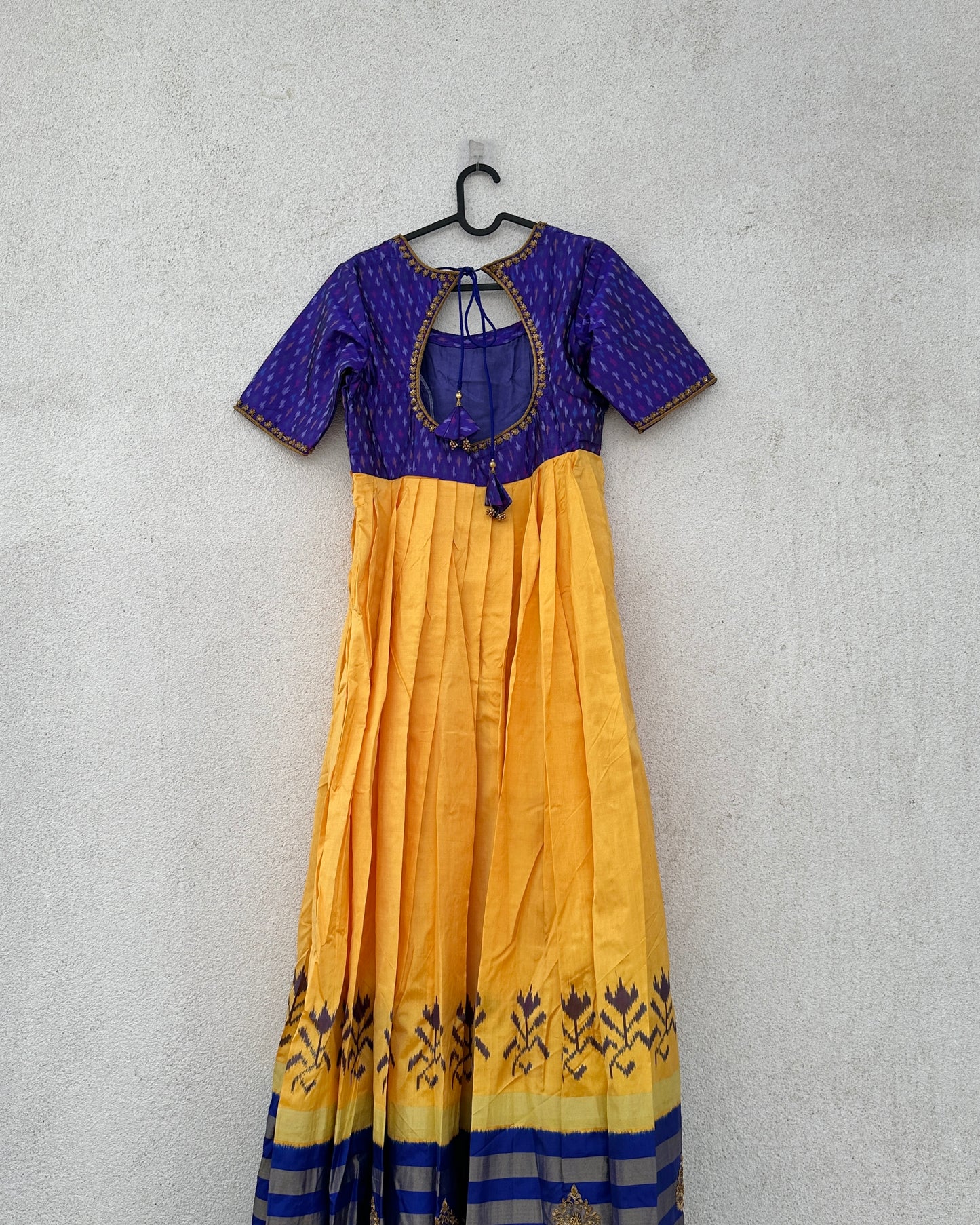 Blue and yellow pleated ikat silk gown with embroidery