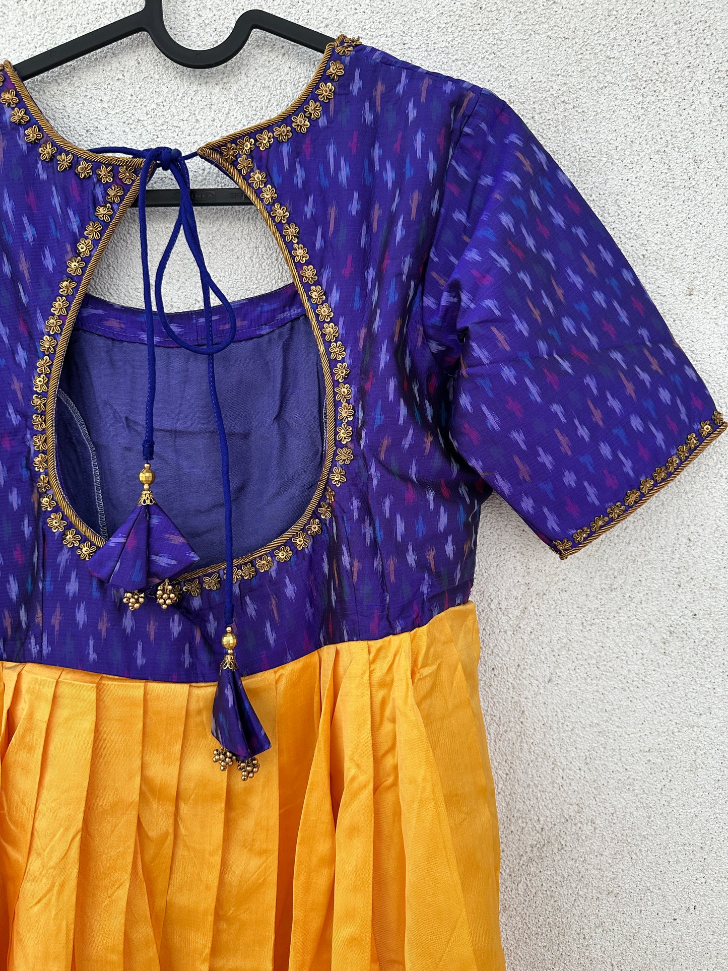 Blue and yellow pleated ikat silk gown with embroidery