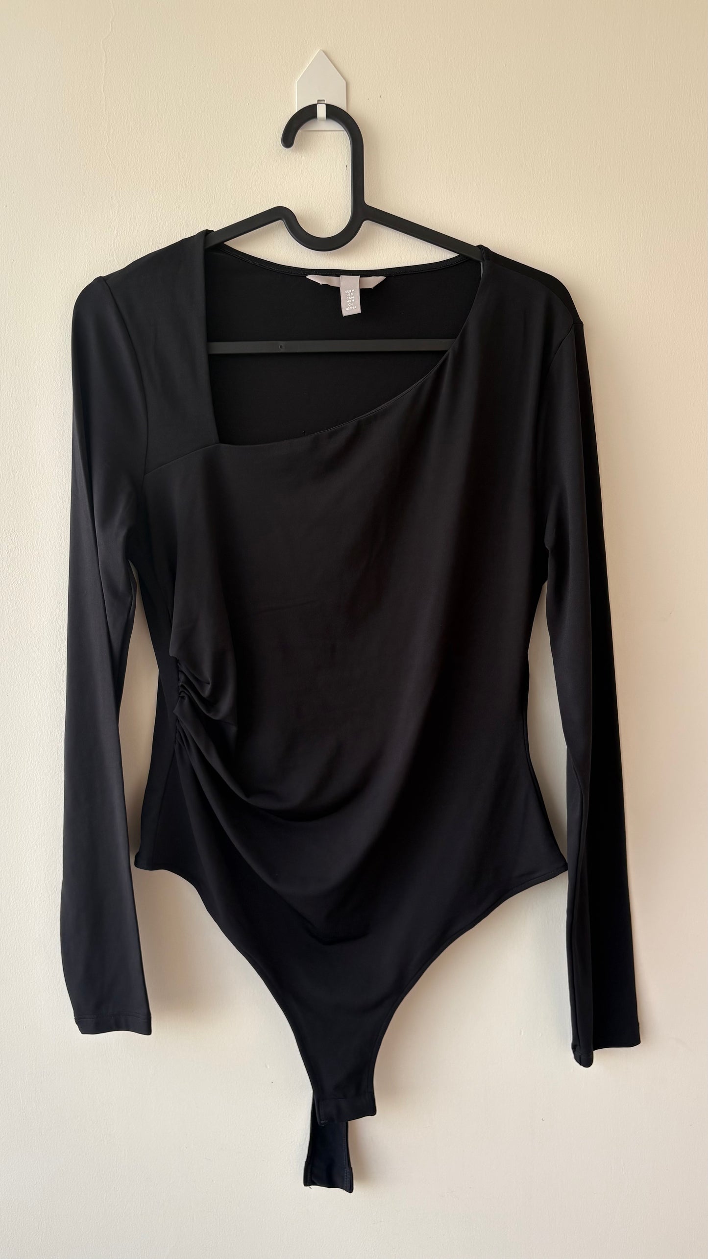 Asymmetric neck black ruched bodysuit