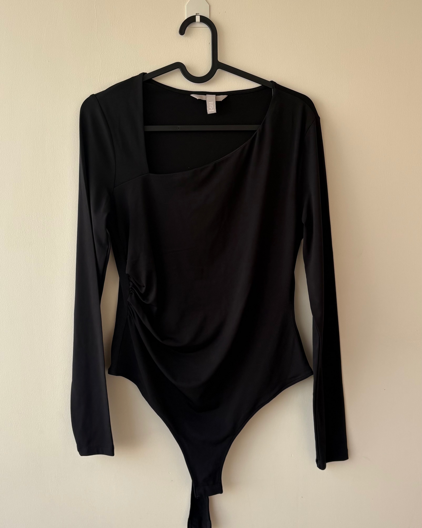 Asymmetric neck black ruched bodysuit