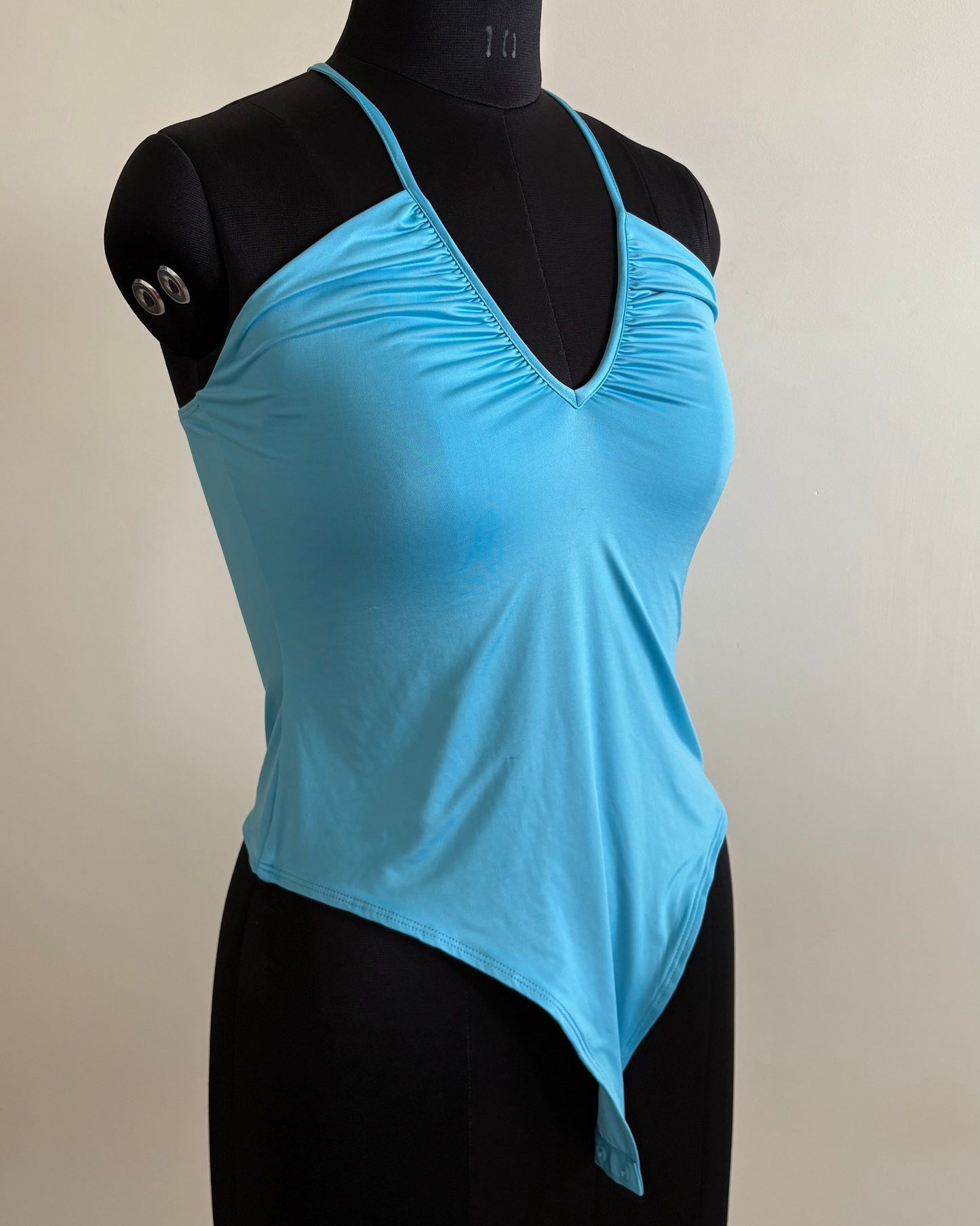 Light blue bodysuit with adjustable straps