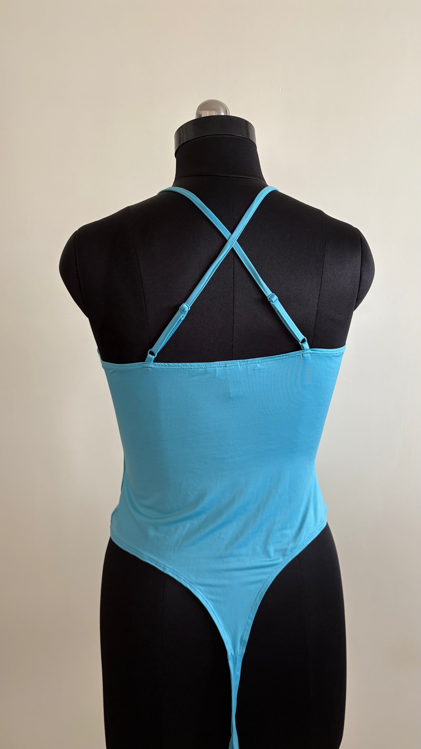 Light blue bodysuit with adjustable straps