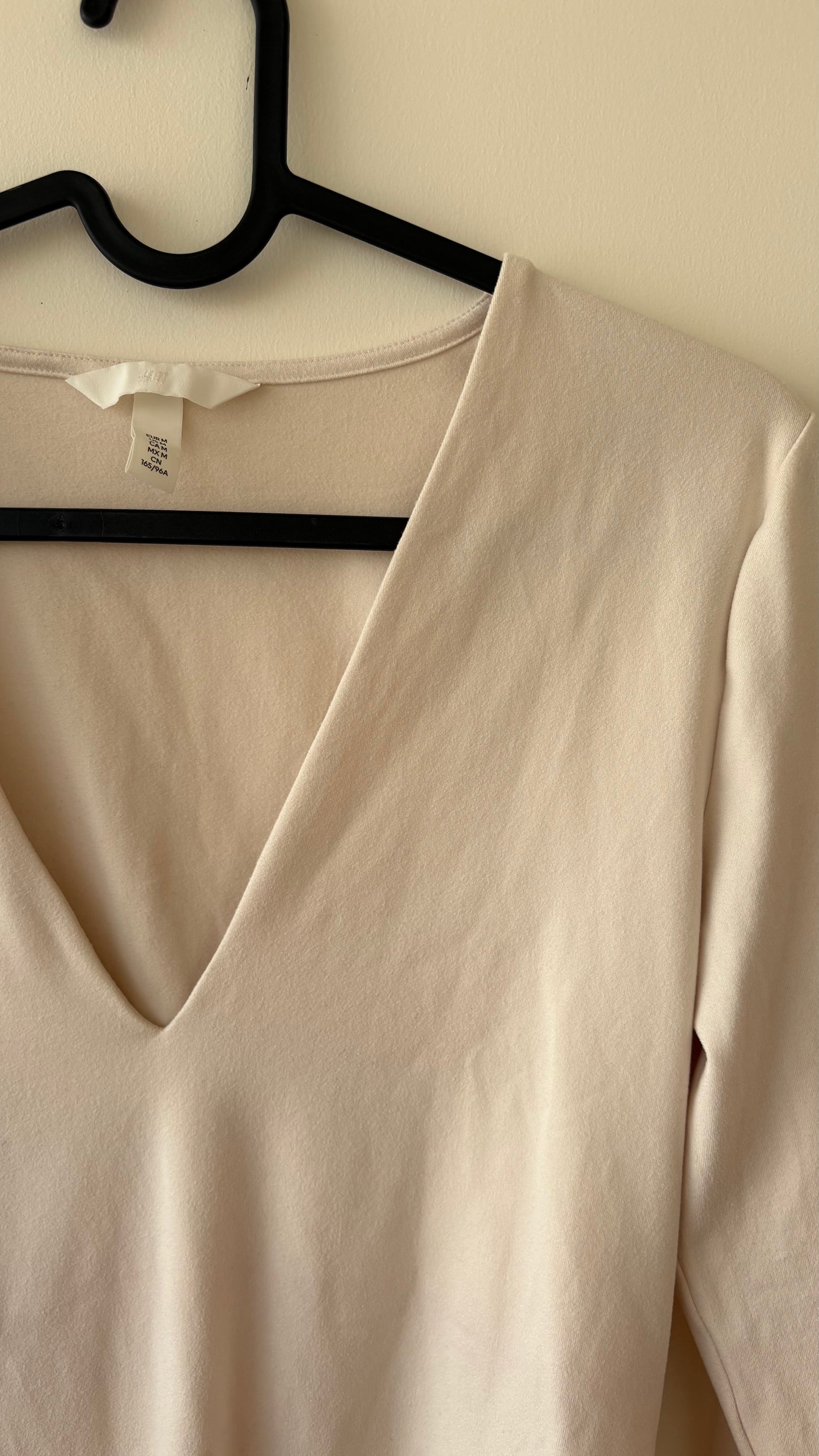 Beige V-neck bodysuit top