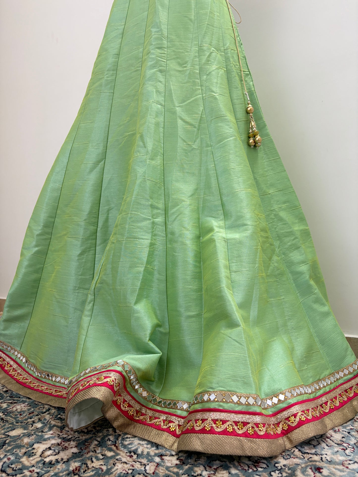 Green lehenga with pink border