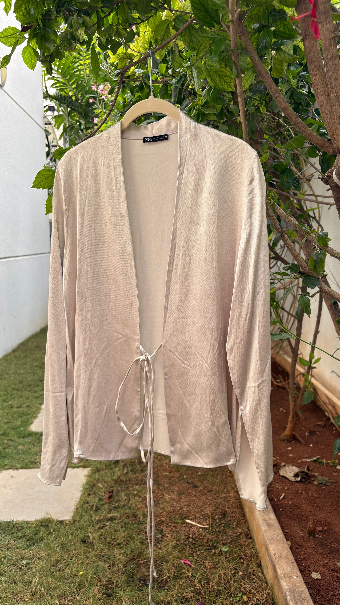 Beige satin pullover style top with tie-ups