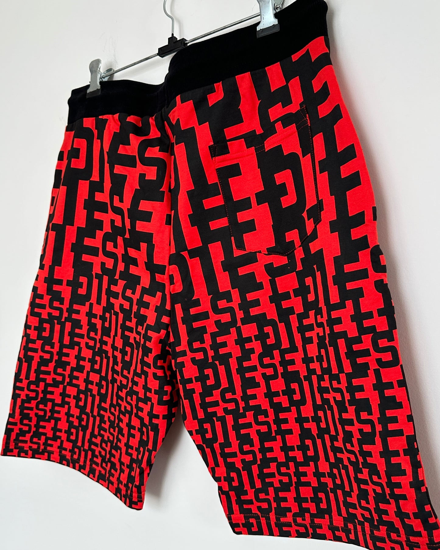 Red and black graphic print men's shorts