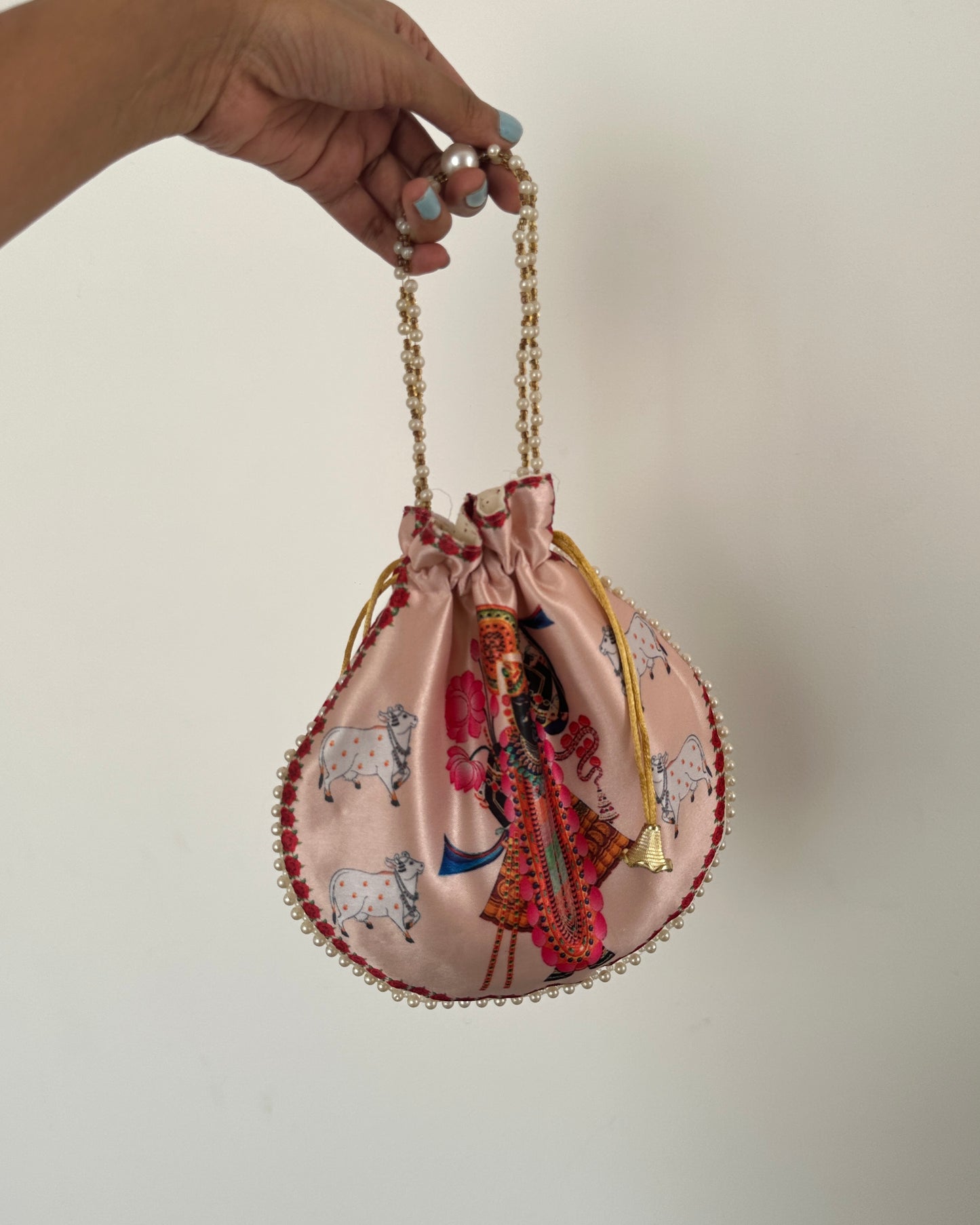 Yellow embroidered potli bag