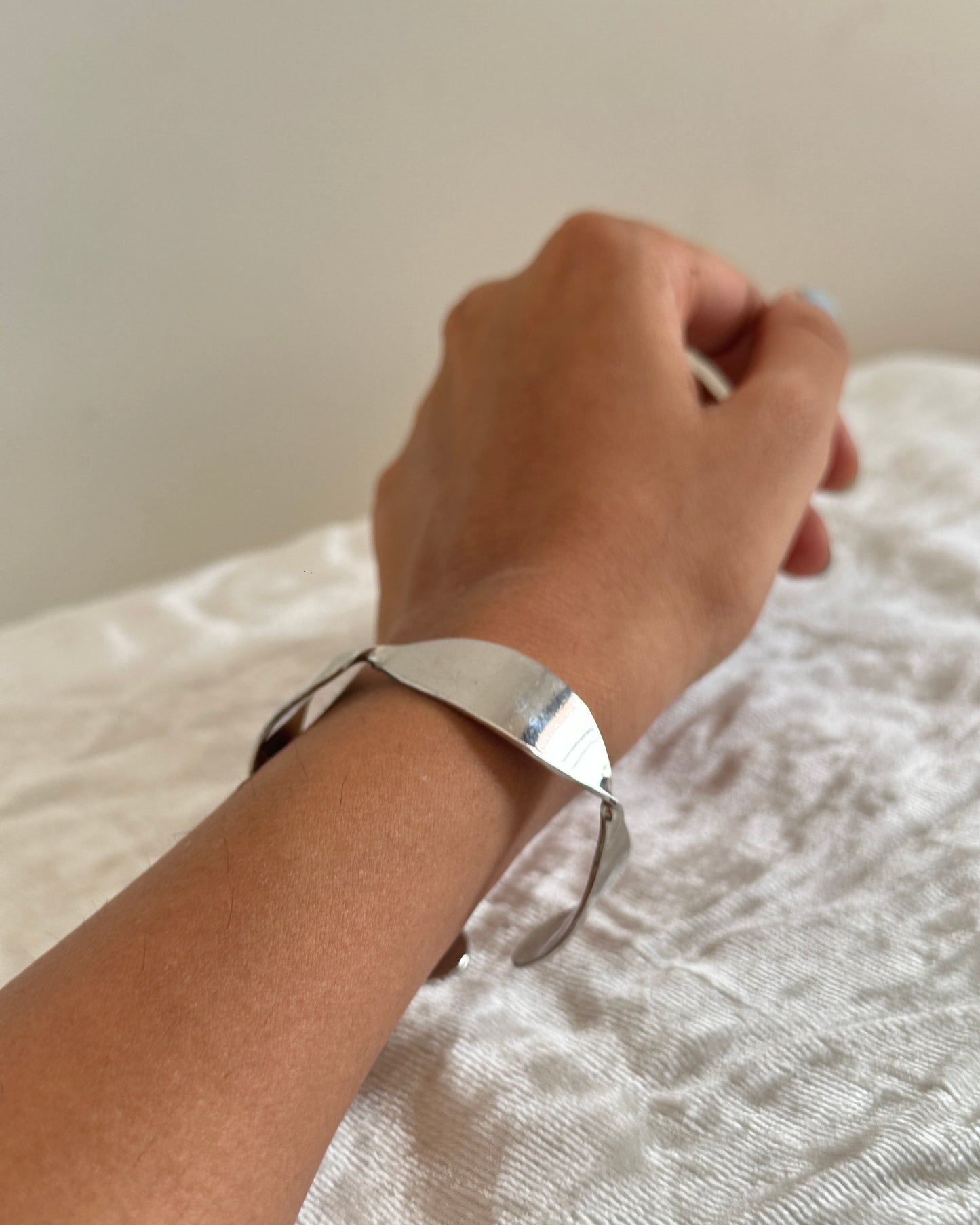 Silver adjustable twisted design cuff
