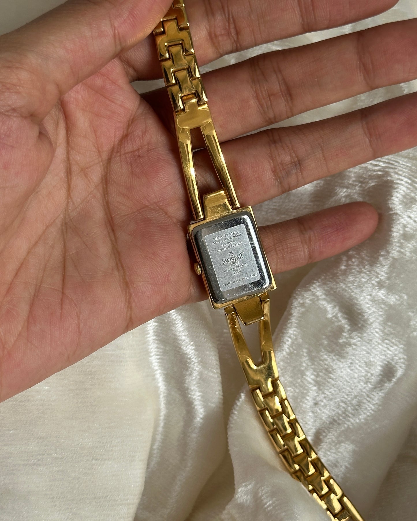 Gold studded watch with blue dial