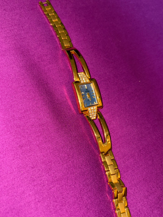 Quartz golden watch with blue dial