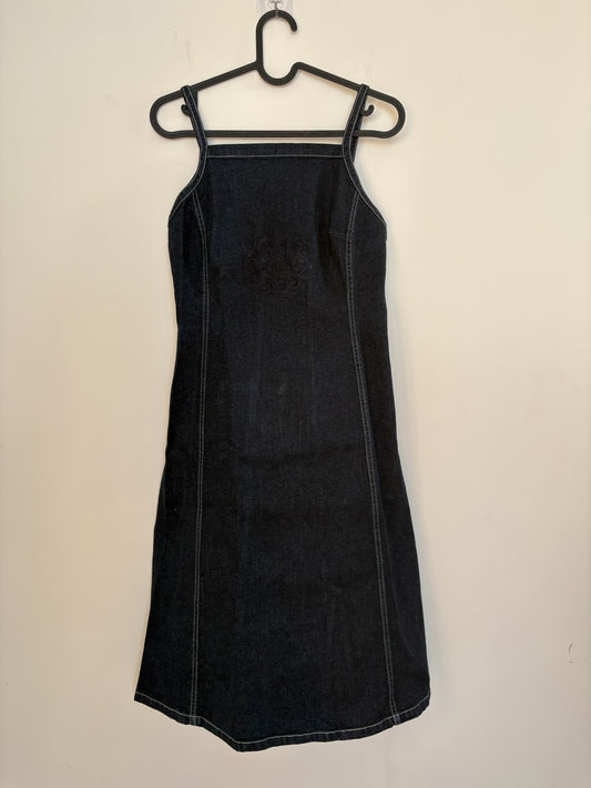 The Circle Betty Jackson Studio dark denim midi dress with square neckline, spaghetti straps, and white topstitching.