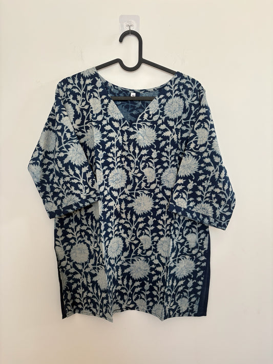 The Circle indigo cotton kurta with a white hand-block floral print, V-neckline, and three-quarter sleeves.