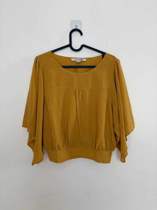 The Circle Forever 21 mustard yellow blouse with flutter sleeves, round neckline, and gathered front detail.