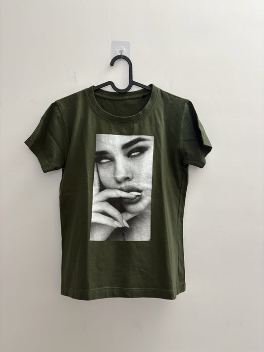 The Circle olive green crew neck t-shirt featuring a black and white photographic print of a woman's face.