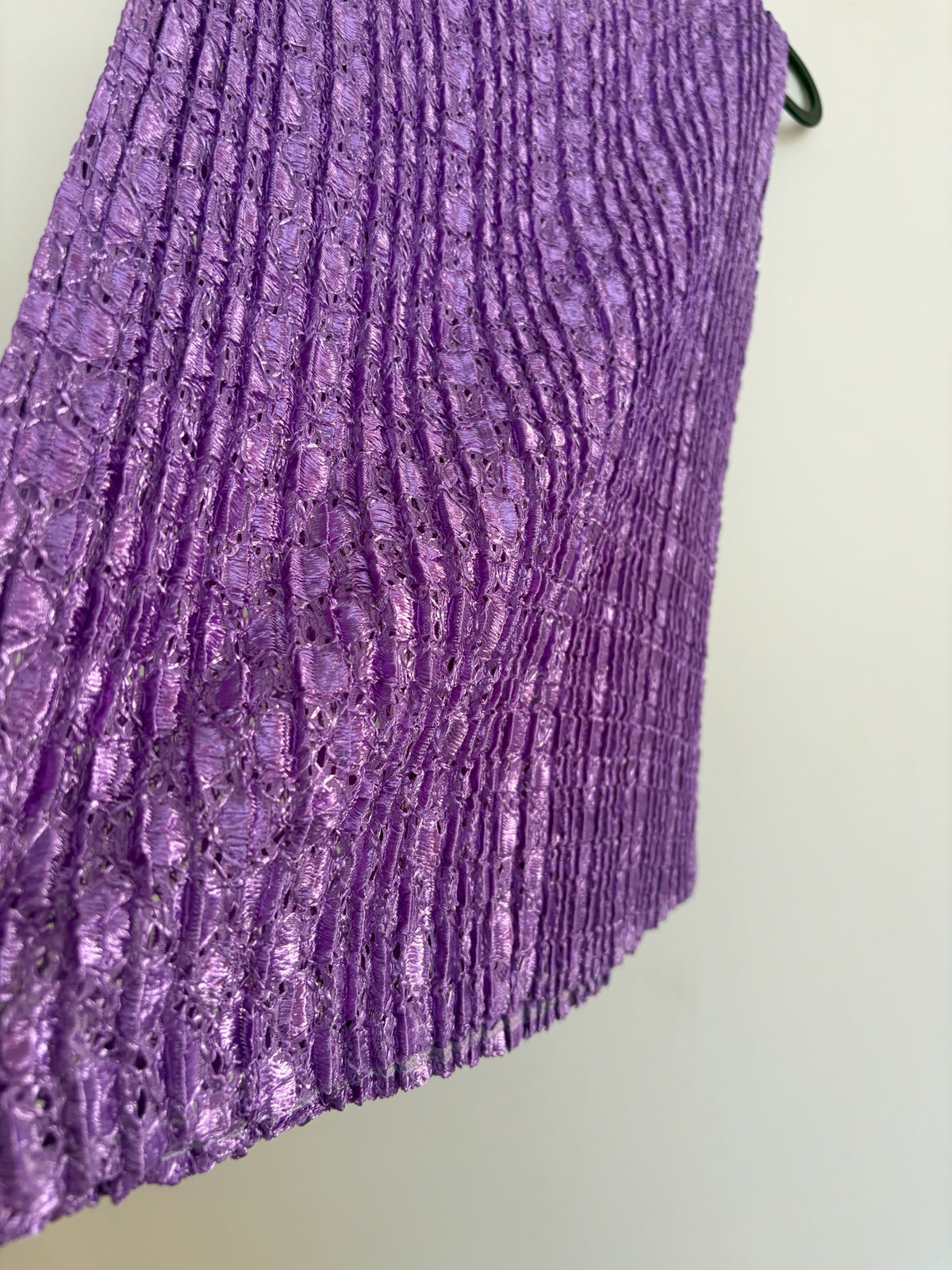 The Circle sleeveless V-neck top in vibrant purple with a unique textured crinkle fabric finish.
