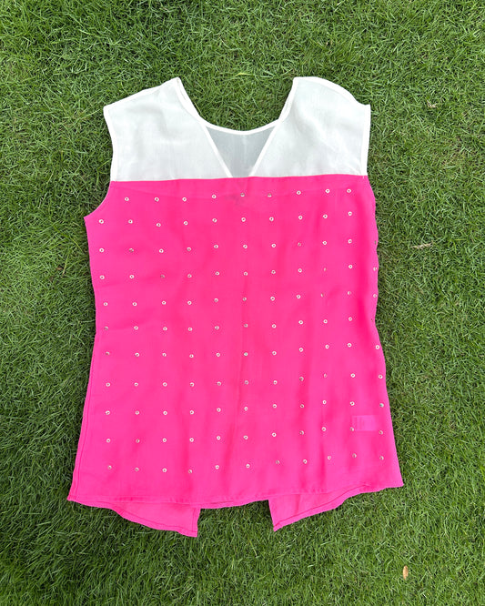 White and pink top with metal eyelets