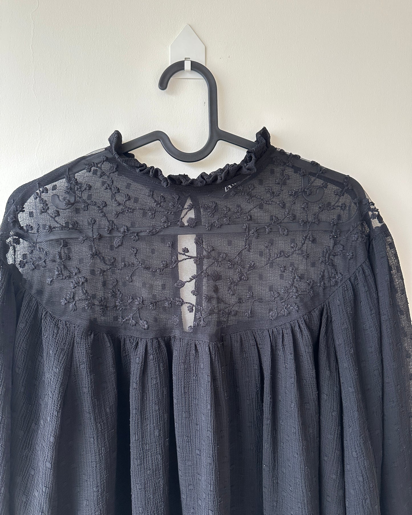 Black lace blouse with sheer neck