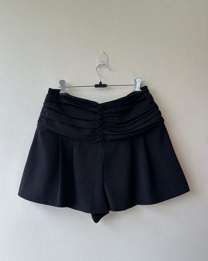 Black pleated high waist shorts with buttons