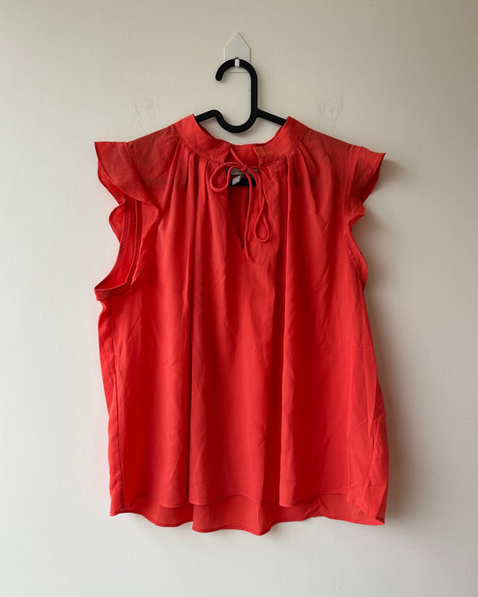 Orange top with flutter sleeves