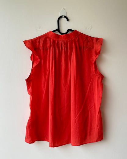Orange top with flutter sleeves