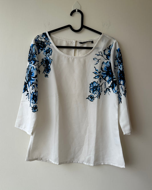 White formal top with blue flowers