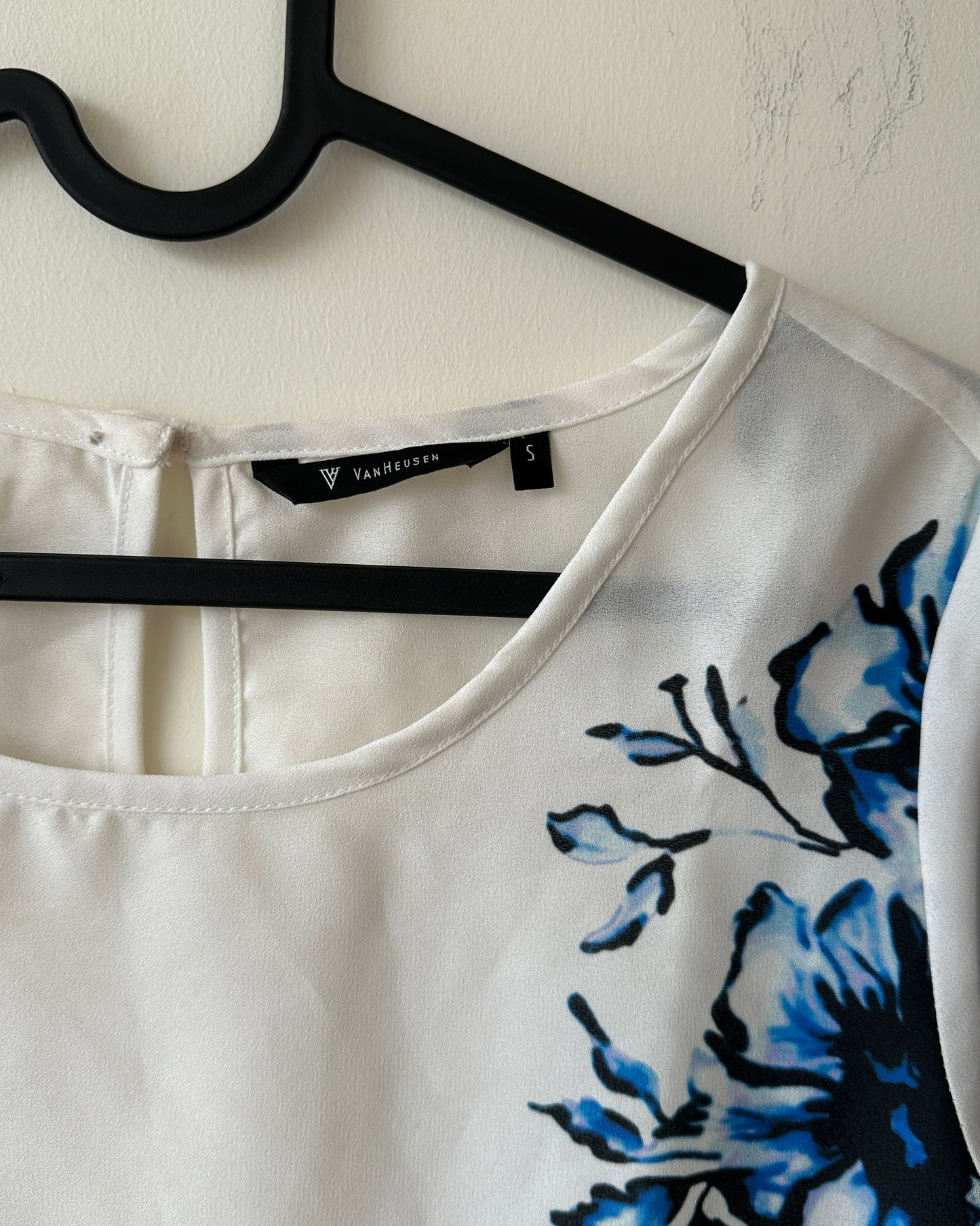 White formal top with blue flowers