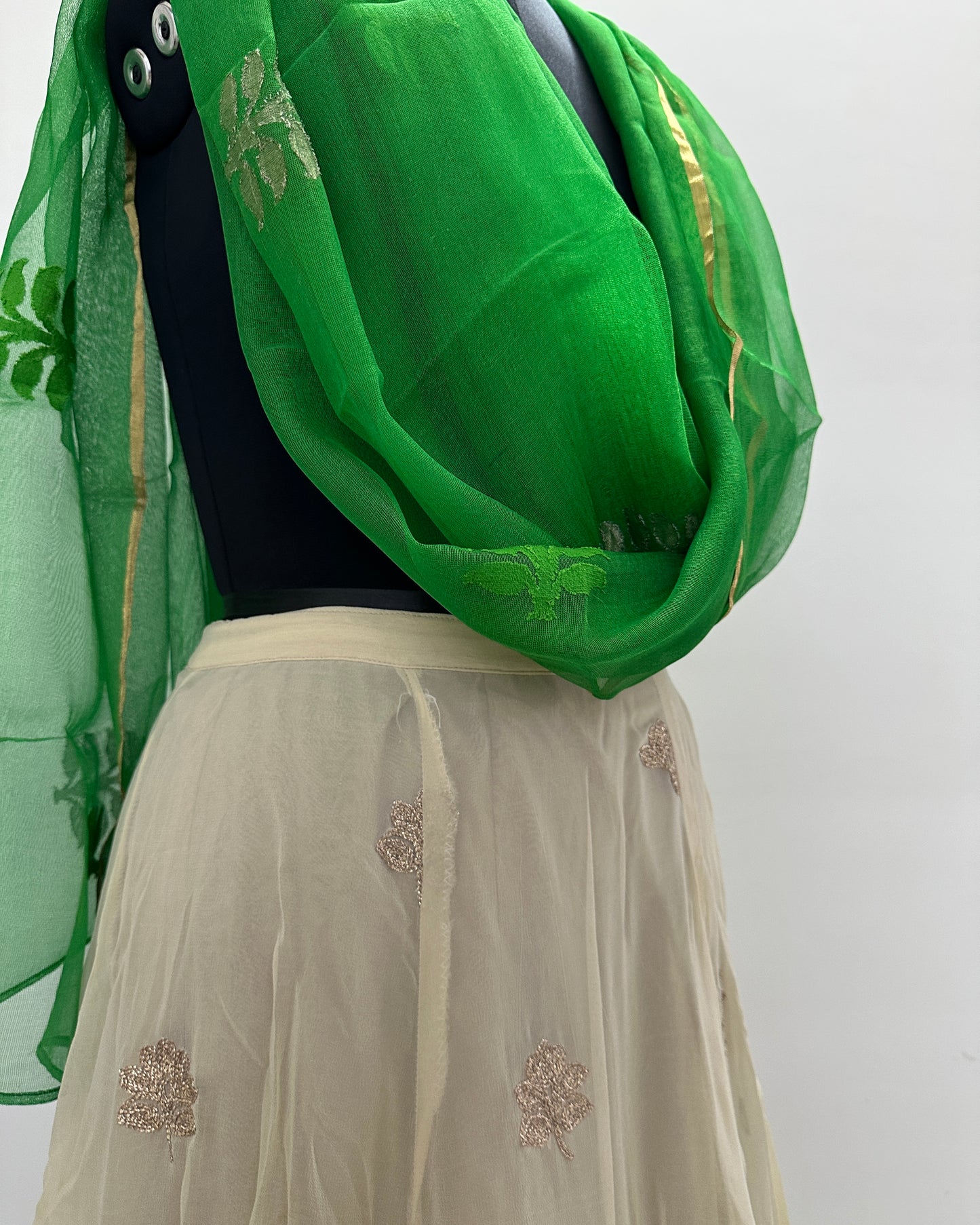 Beige lehenga with green dupatta