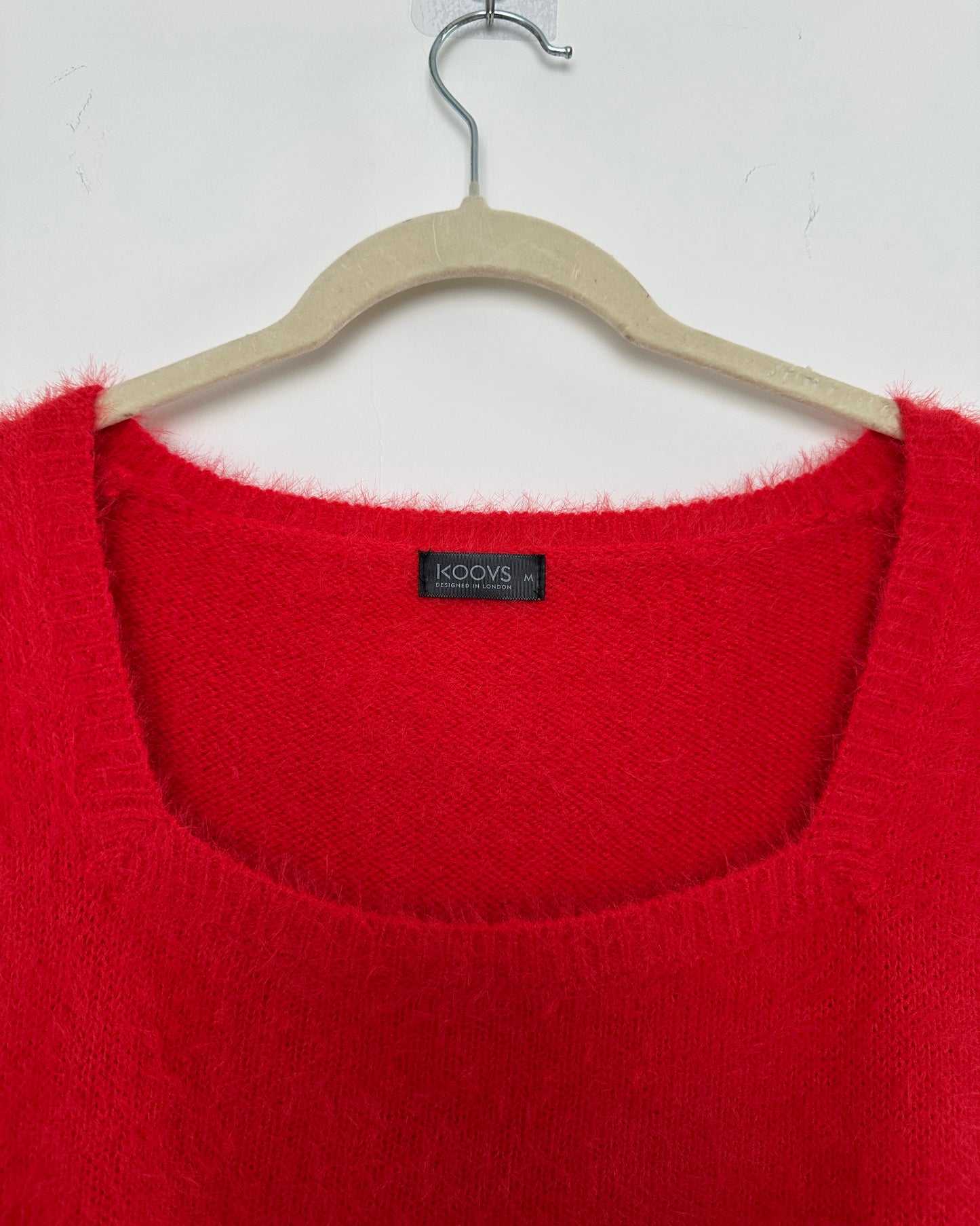 Red knit top with puff sleeves