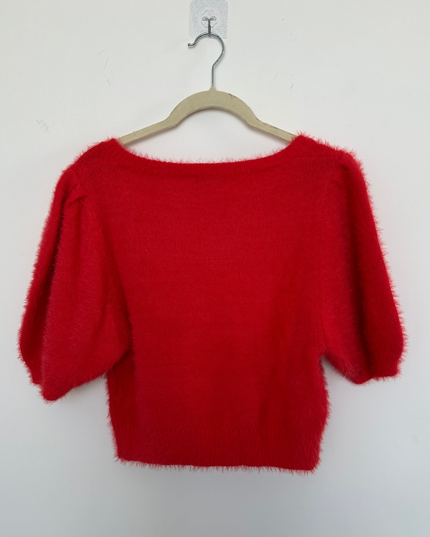 Red knit top with puff sleeves