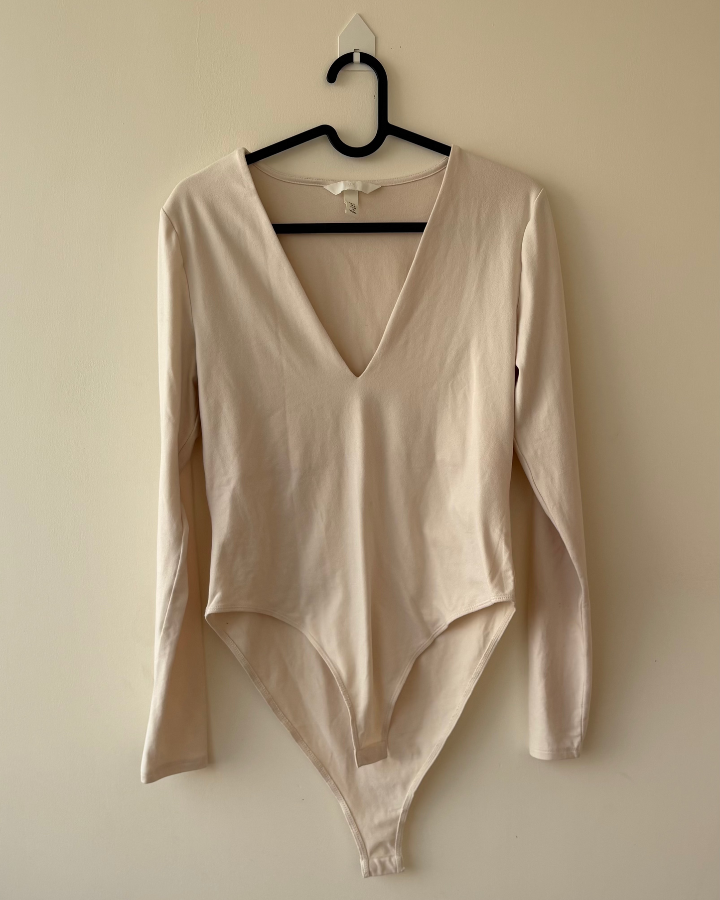Beige V-neck bodysuit top