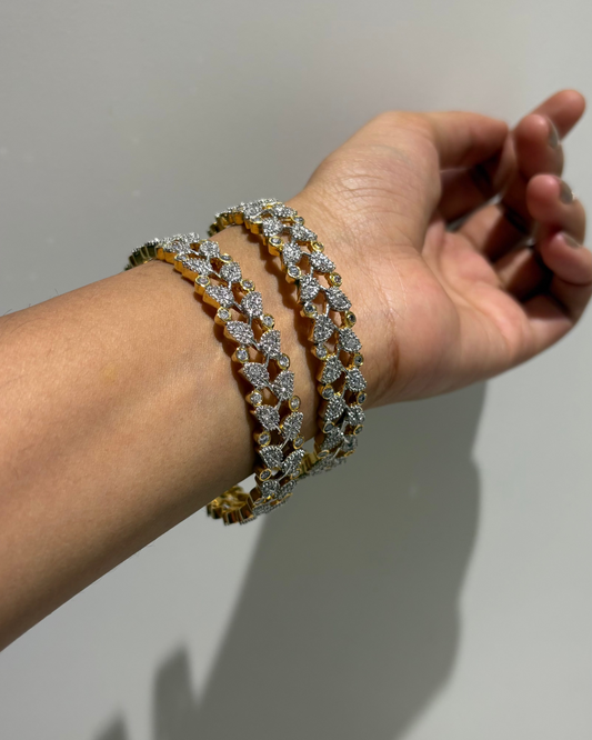 Gold and silver leaf patterned bangles