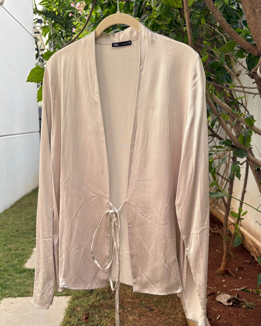 Beige satin pullover style top with tie-ups