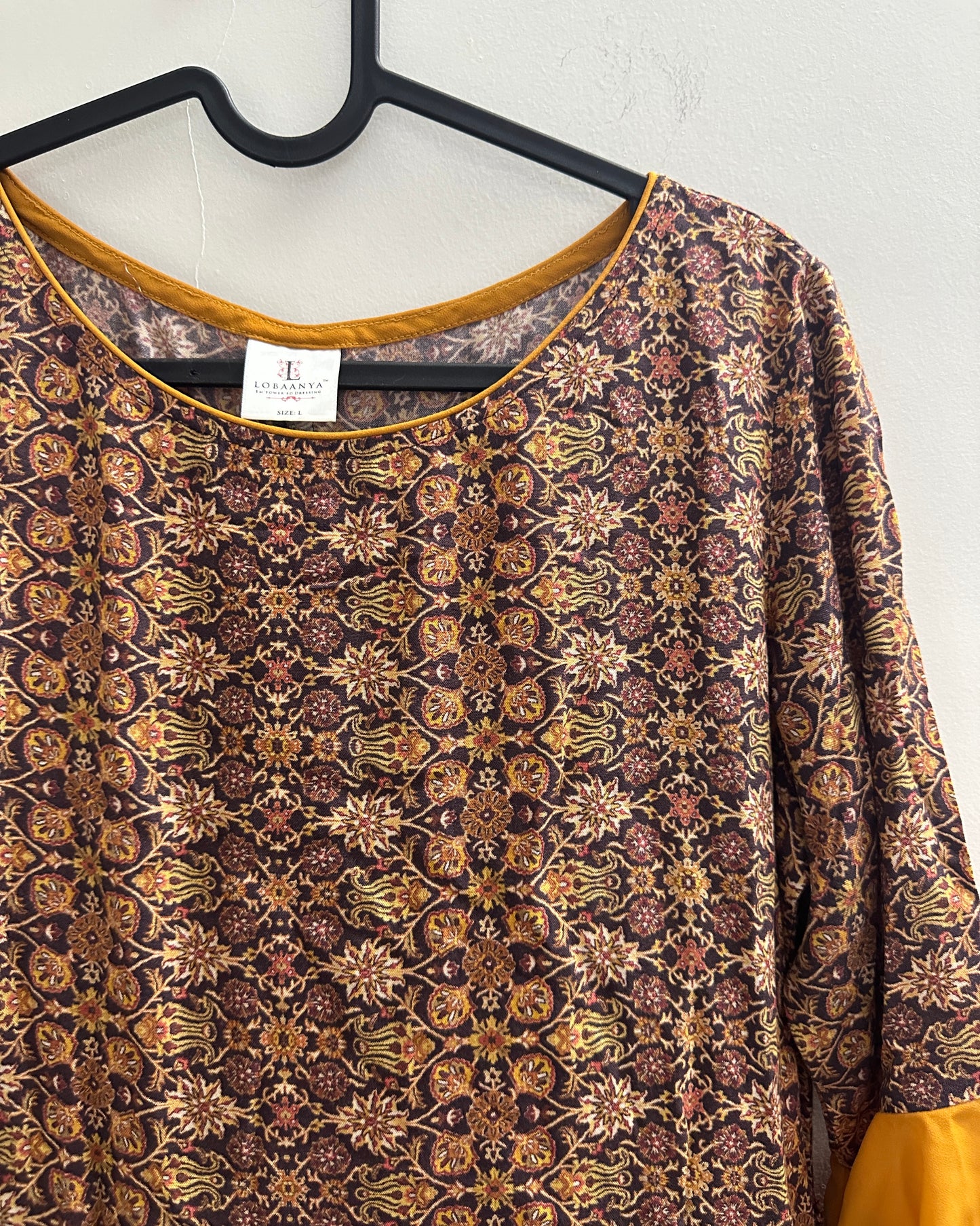 Mustard yellow and brown kurta with front slit , flutter sleeves and trims